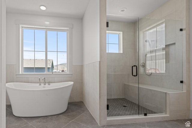 177 E 475 S, Mantua, UT 84324 - full bath featuring a stall shower, a freestanding bath, a wainscoted wall, tile patterned flooring, and tile walls