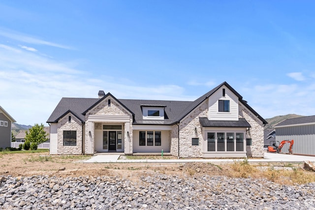 177 E 475 S, Mantua, UT 84324 - view of front facade featuring stone siding, a standing seam roof, a metal roof, and a chimney