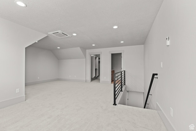 177 E 475 S, Mantua, UT 84324 - additional living space featuring recessed lighting, carpet floors, vaulted ceiling, and a textured ceiling
