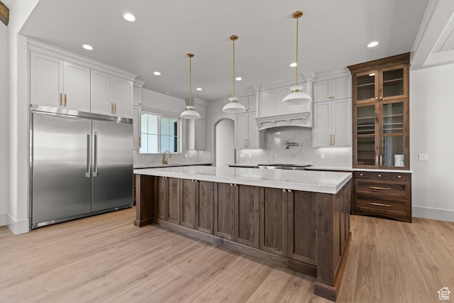 177 E 475 S, Mantua, UT 84324 - kitchen with appliances with stainless steel finishes, light wood-style floors, light countertops, backsplash, and recessed lighting