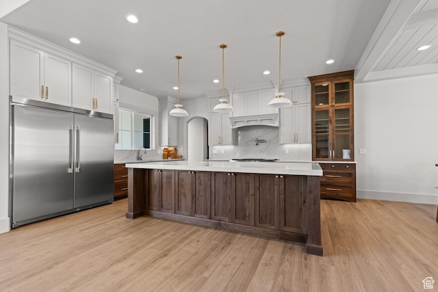 177 E 475 S, Mantua, UT 84324 - kitchen featuring appliances with stainless steel finishes, decorative backsplash, light countertops, light wood-style floors, and recessed lighting