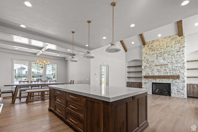 177 E 475 S, Mantua, UT 84324 - kitchen with beamed ceiling, light wood-style floors, recessed lighting, a center island, and a stone fireplace