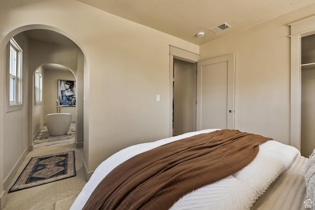 1444 E Sherman Ave, Salt Lake City, UT 84105 - bedroom with carpet floors and arched walkways