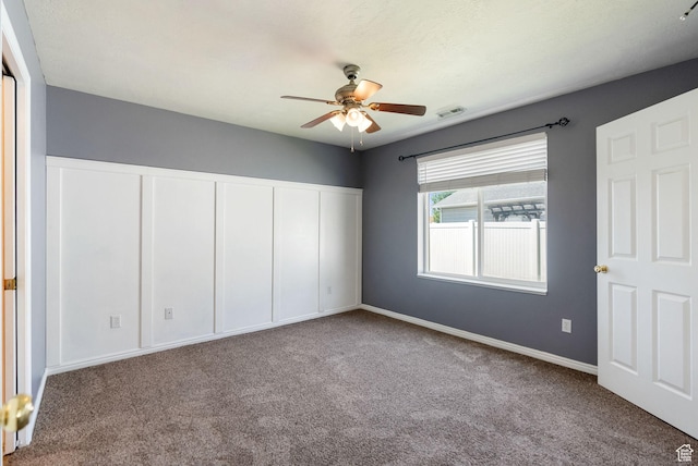 145 Teal Loop, Logan, UT 84321 - unfurnished bedroom featuring carpet, a closet, and ceiling fan