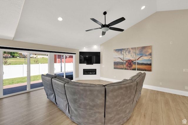 1788 N 925 E, North Ogden, UT 84414 - living area featuring lofted ceiling, light wood-style floors, ceiling fan, recessed lighting, and a glass covered fireplace