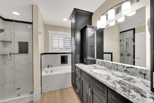 1788 N 925 E, North Ogden, UT 84414 - bathroom with a bath, vanity, a marble finish shower, and wood finished floors