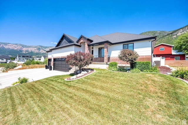 1788 N 925 E, North Ogden, UT 84414 - view of front of house featuring brick siding, a mountain view, and driveway