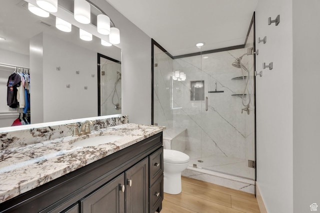 1788 N 925 E, North Ogden, UT 84414 - bathroom featuring vanity, a marble finish shower, wood finished floors, recessed lighting, and a spacious closet
