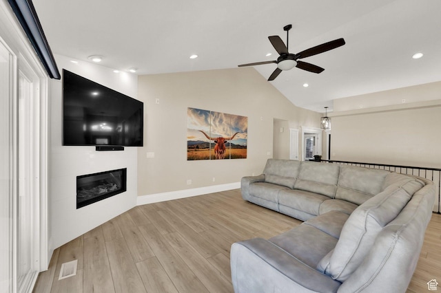 1788 N 925 E, North Ogden, UT 84414 - living room with a ceiling fan, light wood-style floors, a fireplace, vaulted ceiling, and recessed lighting