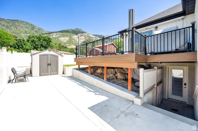 1788 N 925 E, North Ogden, UT 84414 - view of patio featuring a storage unit, a deck with mountain view, and stairway