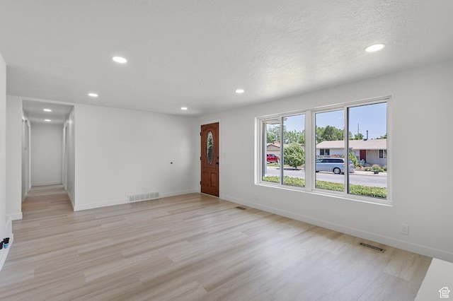 5600 S Ralph Dr, Taylorsville, UT 84129 - spare room featuring recessed lighting and light wood-type flooring