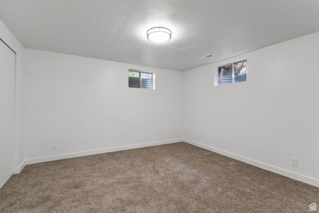 5600 S Ralph Dr, Taylorsville, UT 84129 - basement featuring carpet flooring and a textured ceiling