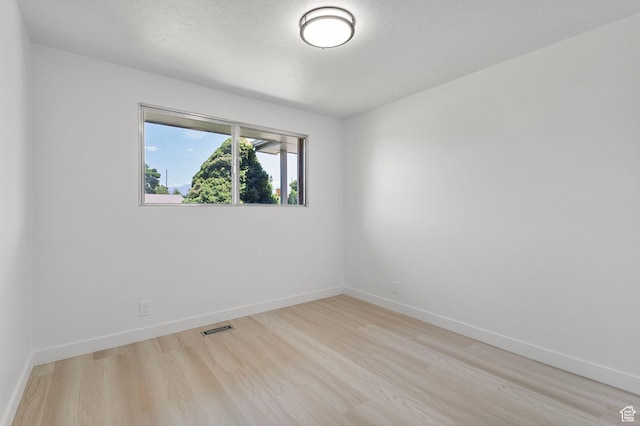 5600 S Ralph Dr, Taylorsville, UT 84129 - empty room featuring light wood-style flooring and baseboards