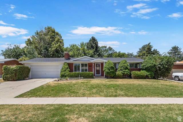 5600 S Ralph Dr, Taylorsville, UT 84129 - single story home with a garage, a front yard, concrete driveway, a chimney, and brick siding