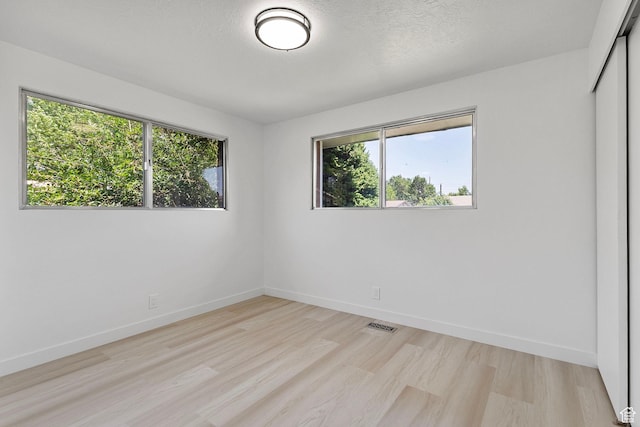 5600 S Ralph Dr, Taylorsville, UT 84129 - spare room with light wood-style flooring and healthy amount of natural light