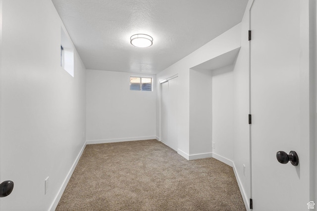 5600 S Ralph Dr, Taylorsville, UT 84129 - below grade area with carpet floors and a textured ceiling