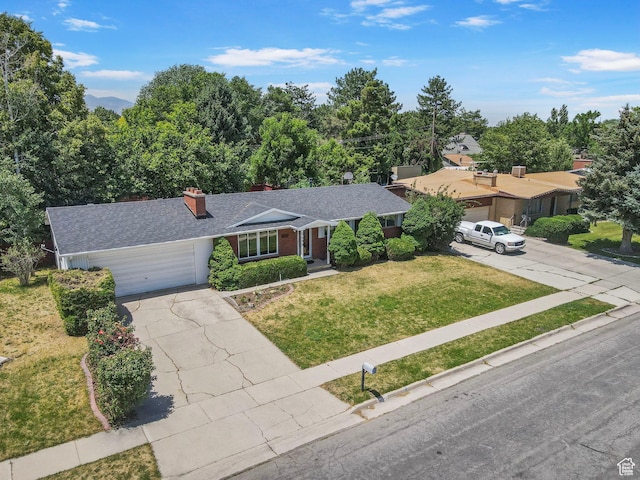 5600 S Ralph Dr, Taylorsville, UT 84129 - ranch-style home featuring an attached garage, a front yard, driveway, a chimney, and roof with shingles