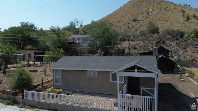 365 Hill St, Helper, UT 84526 - view of front of house featuring a chimney and a mountain view
