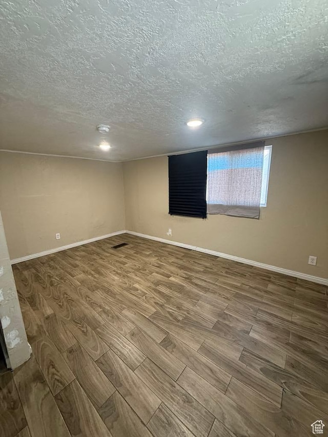 365 Hill St, Helper, UT 84526 - unfurnished room with a textured ceiling, wood finished floors, and recessed lighting