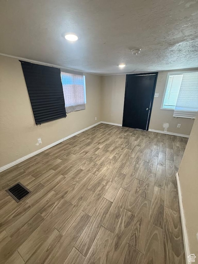 365 Hill St, Helper, UT 84526 - spare room featuring wood finished floors, plenty of natural light, and recessed lighting