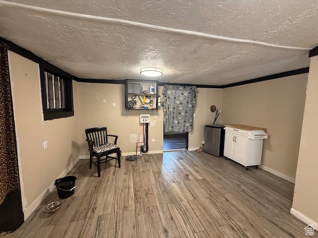 365 Hill St, Helper, UT 84526 - unfurnished room with wood finished floors and a textured ceiling