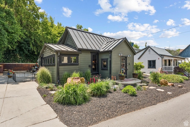 1439 Woodside Ave, Park City, UT 84060 - bungalow with a standing seam roof, a gate, and a metal roof