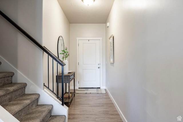 728 W 12260 S, Draper, UT 84020 - doorway to outside featuring wood finished floors and stairs
