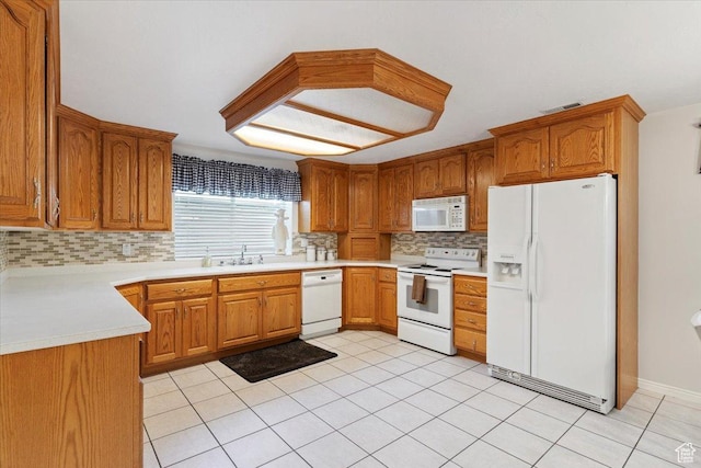 7258 S Mel Helen Way, West Jordan, UT 84084 - kitchen with white appliances, backsplash, brown cabinets, light countertops, and light tile patterned flooring