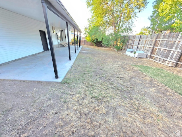 3797 S Armoridge Dr, Magna, UT 84044 - fenced backyard featuring a patio area