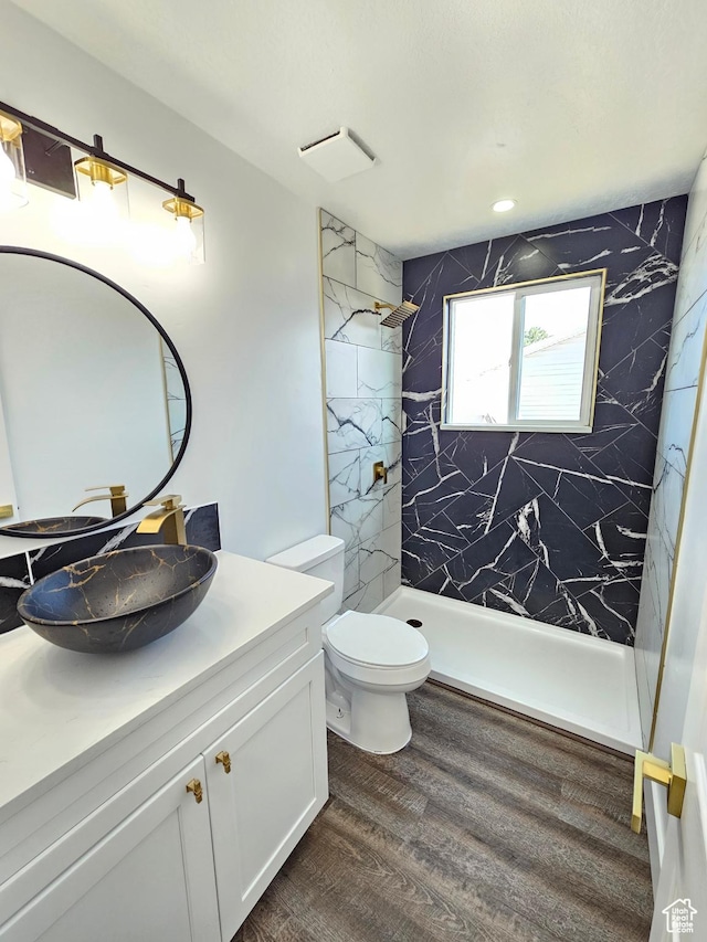 3797 S Armoridge Dr, Magna, UT 84044 - bathroom with vanity, a marble finish shower, and wood finished floors