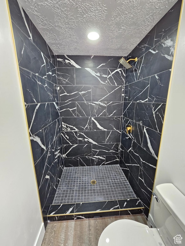 3797 S Armoridge Dr, Magna, UT 84044 - bathroom featuring a stall shower, recessed lighting, a textured ceiling, and wood finished floors