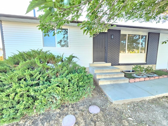 3797 S Armoridge Dr, Magna, UT 84044 - doorway to property with brick siding