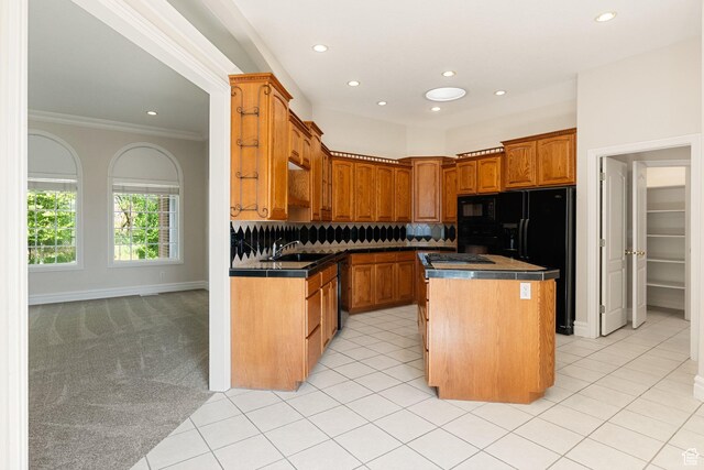831 N Brookside Dr, Preston, ID 83263 - kitchen with black appliances, recessed lighting, a center island, crown molding, and decorative backsplash
