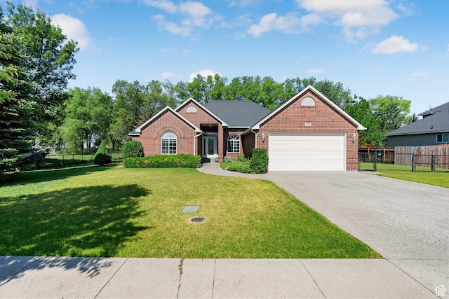 831 N Brookside Dr, Preston, ID 83263 - view of front facade with brick siding, an attached garage, and concrete driveway