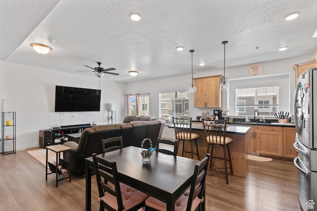 4211 W Camp Floyd Ct, Riverton, UT 84096 - dining space featuring a textured ceiling, wood finished floors, a ceiling fan, and recessed lighting