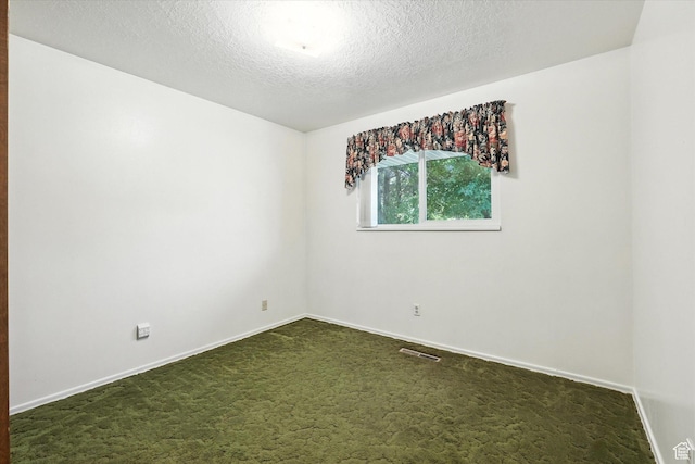 434 River Heights Blvd, River Heights, UT 84321 - spare room with dark colored carpet and a textured ceiling