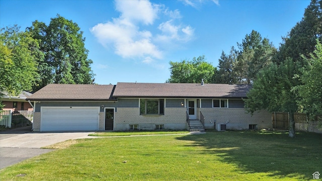 434 River Heights Blvd, River Heights, UT 84321 - ranch-style home with an attached garage, driveway, brick siding, and entry steps