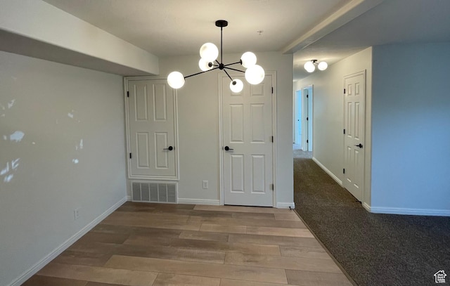 8176 N Cedar Springs Rd Unit V3, Eagle Mountain, UT 84005 - unfurnished dining area featuring wood finished floors and a chandelier