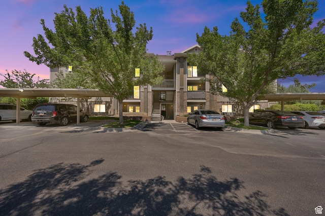 8176 N Cedar Springs Rd Unit V3, Eagle Mountain, UT 84005 - property at dusk with covered parking