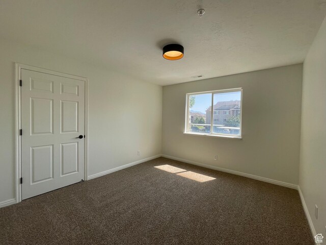 8176 N Cedar Springs Rd Unit V3, Eagle Mountain, UT 84005 - empty room with dark carpet and baseboards
