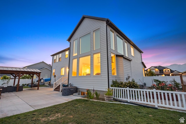1401 W 1930 N, Pleasant Grove, UT 84062 - property exterior at dusk with a gazebo and a patio area