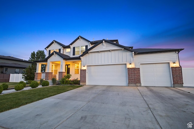 1401 W 1930 N, Pleasant Grove, UT 84062 - view of front of property featuring a garage, driveway, board and batten siding, brick siding, and a porch