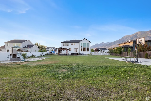 1401 W 1930 N, Pleasant Grove, UT 84062 - fenced backyard featuring a gazebo, a mountain view, a patio area, and a playground