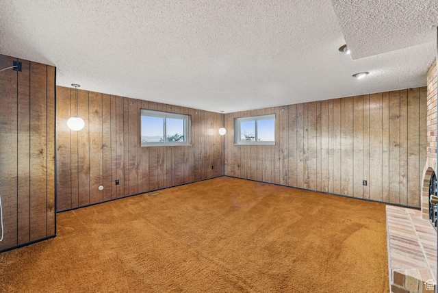 3327 S Crestwood Dr, Salt Lake City, UT 84109 - basement featuring wooden walls, carpet floors, and a textured ceiling