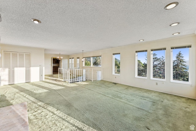3327 S Crestwood Dr, Salt Lake City, UT 84109 - carpeted spare room with a textured ceiling, a chandelier, and recessed lighting
