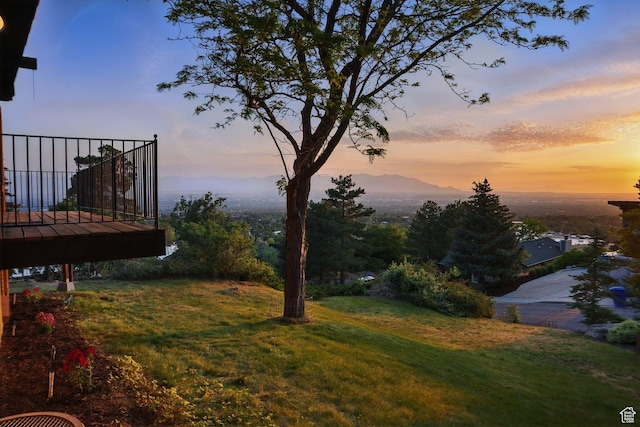3327 S Crestwood Dr, Salt Lake City, UT 84109 - yard at dusk featuring a lawn and a deck