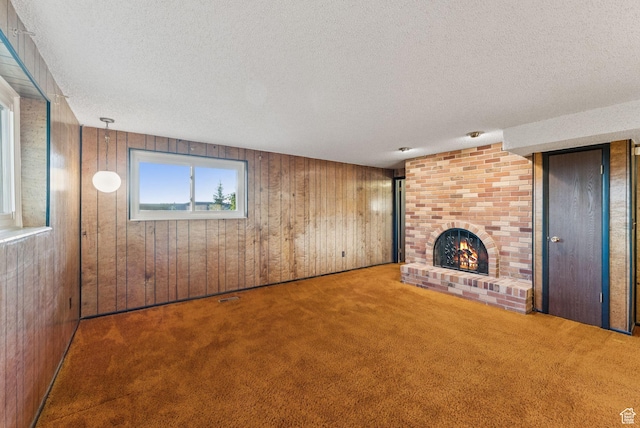 3327 S Crestwood Dr, Salt Lake City, UT 84109 - unfurnished living room with a textured ceiling, carpet floors, wooden walls, and a brick fireplace