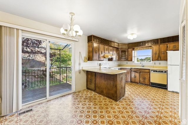 3327 S Crestwood Dr, Salt Lake City, UT 84109 - kitchen with dishwashing machine, freestanding refrigerator, a peninsula, light countertops, and under cabinet range hood