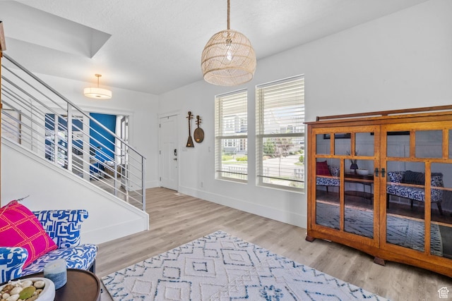11571 S Skyward Rd W, South Jordan, UT 84009 - foyer entrance with stairway and wood finished floors