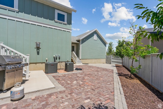 11571 S Skyward Rd W, South Jordan, UT 84009 - fenced backyard with a grill, entry steps, and a patio area